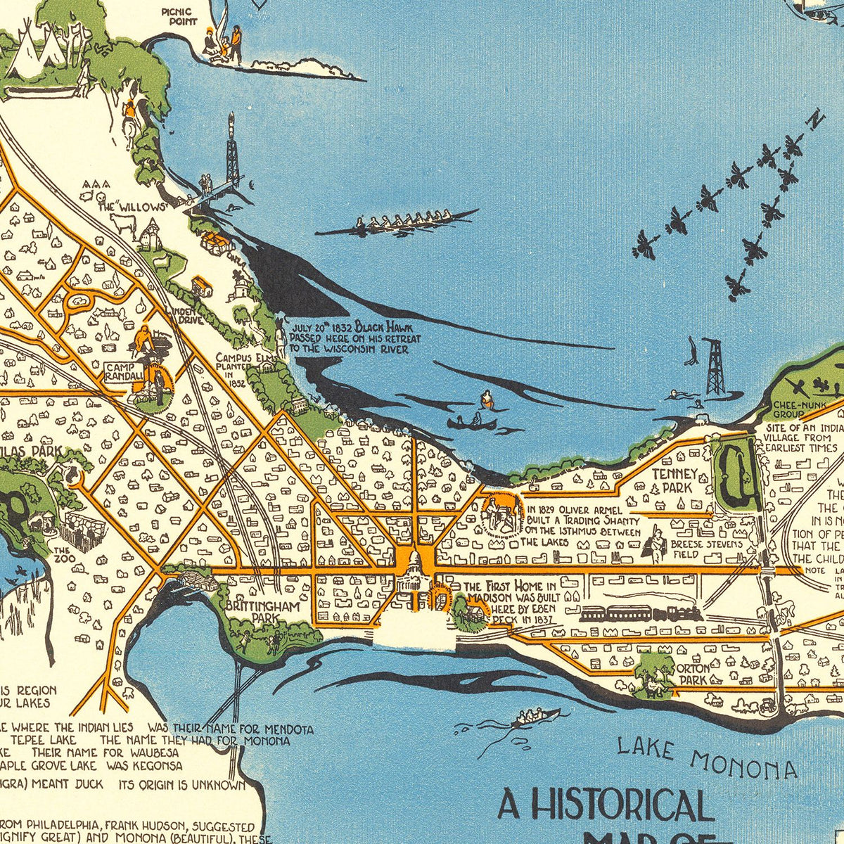 A framed vintage map displayed in a warm and thoughtfully designed interior
