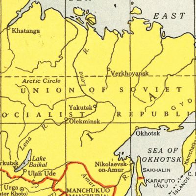 A framed vintage map displayed in a warm and thoughtfully designed interior