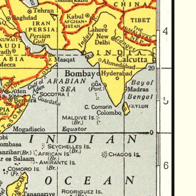 A framed vintage map displayed in a warm and thoughtfully designed interior